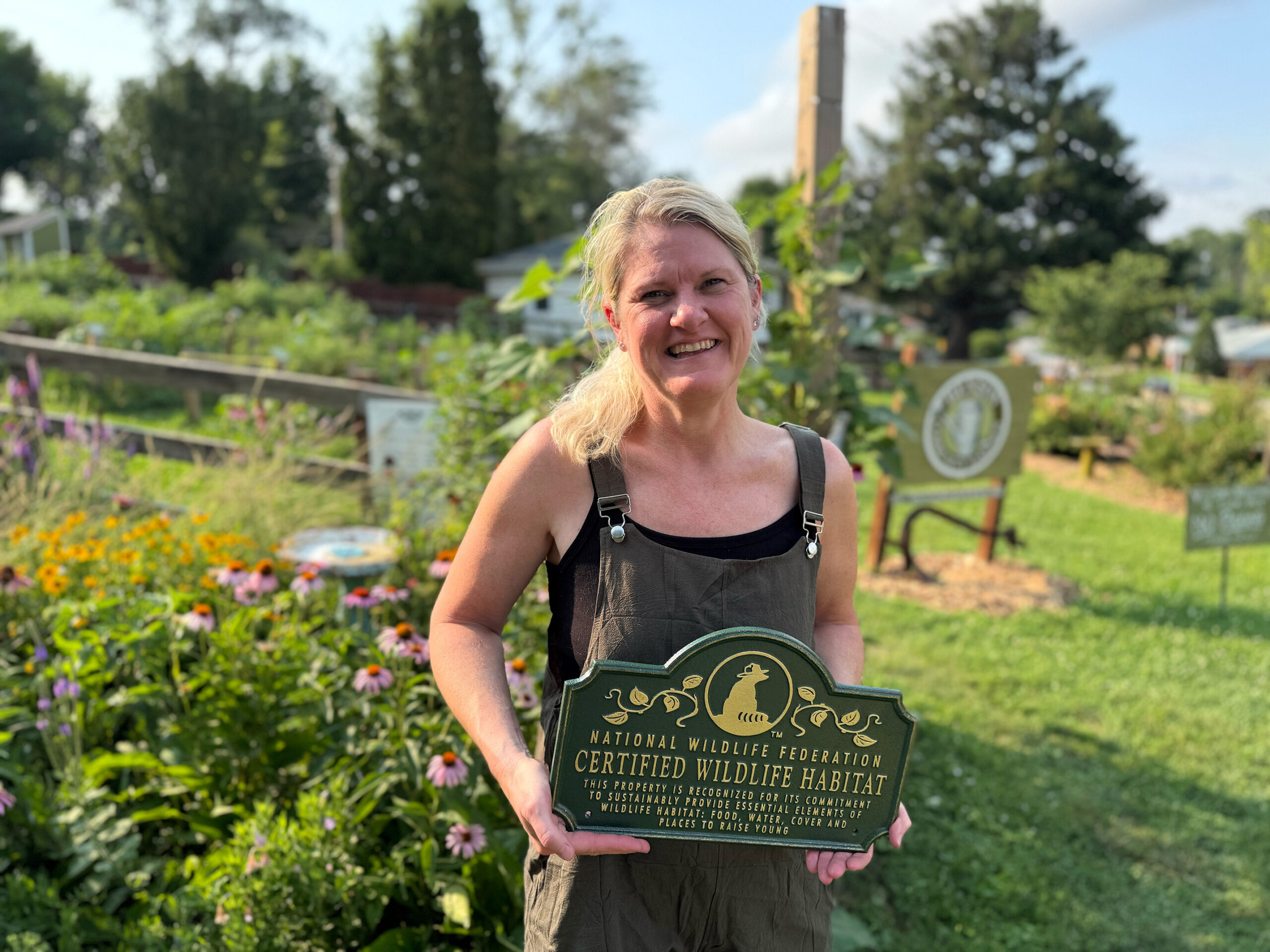 Jenny Goetzinger holding a National Wildlife Federation plaque